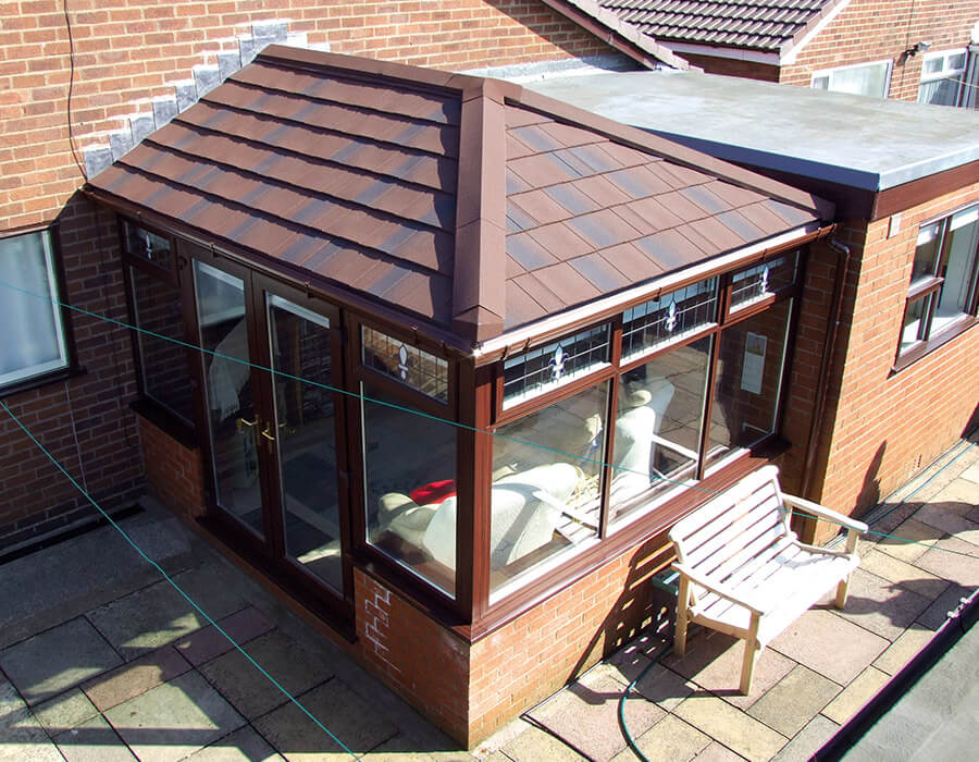 uPVC edwardian conservatory with a brown tiled roof