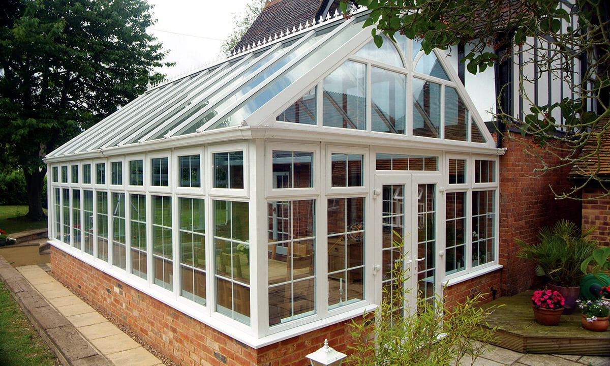 White uPVC gable conservatory with a glass roof