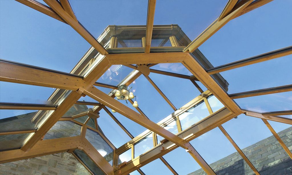 Interior view of a glass conservatory roof with an irish oak coloured frame