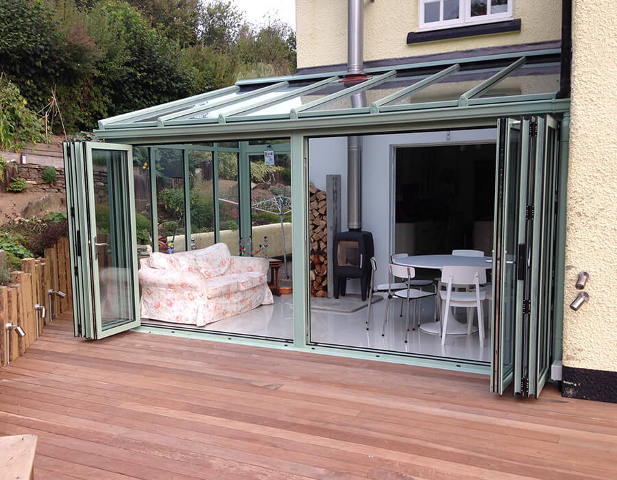 Chartwell green lean to conservatory with bifold doors
