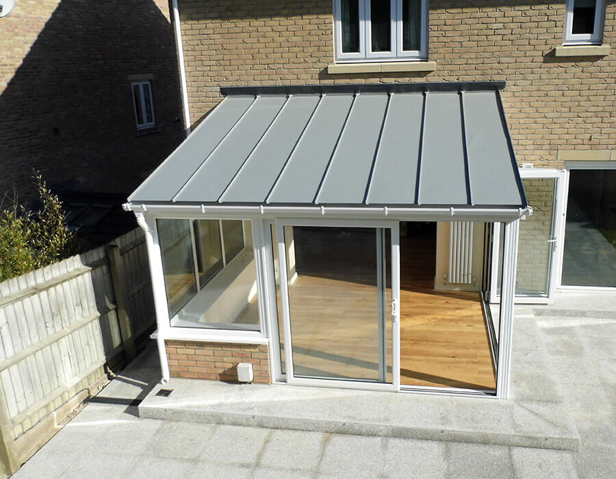 White uPVC lean to conservatory with a solid roof