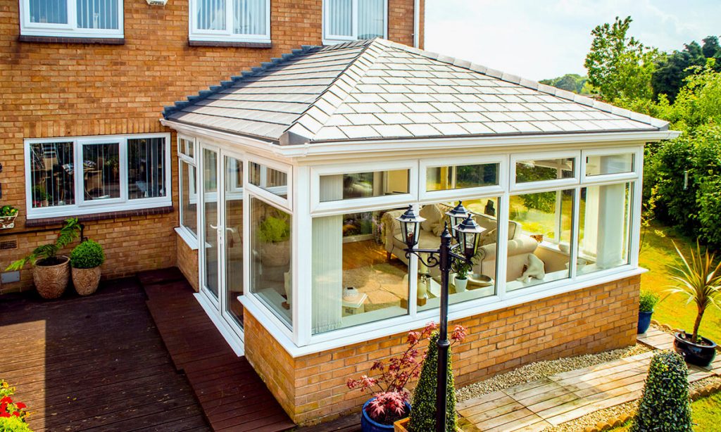 White uPVC conservatory with a tiled roof