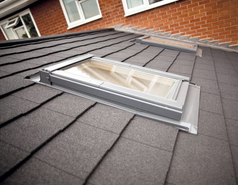 Grey tiled conservatory roof with roof lights