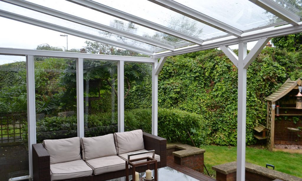 A white uPVC canopy with a glass roof