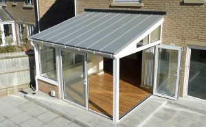 White uPVC lean to conservatory with a solid roof