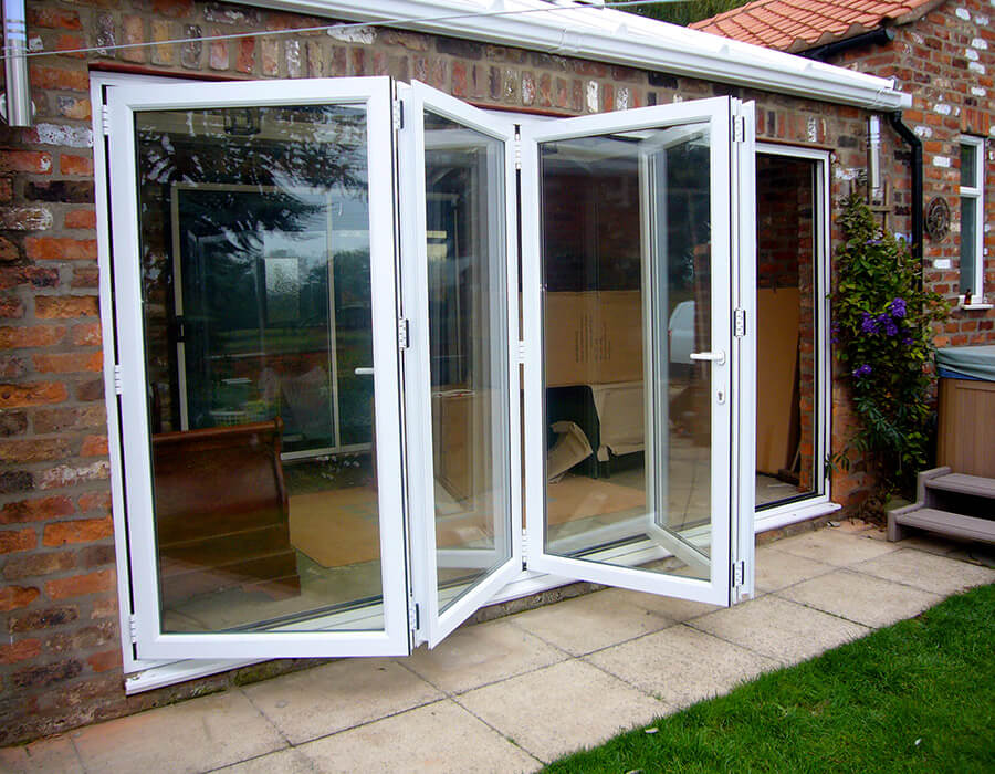 Open white uPVC bifold door