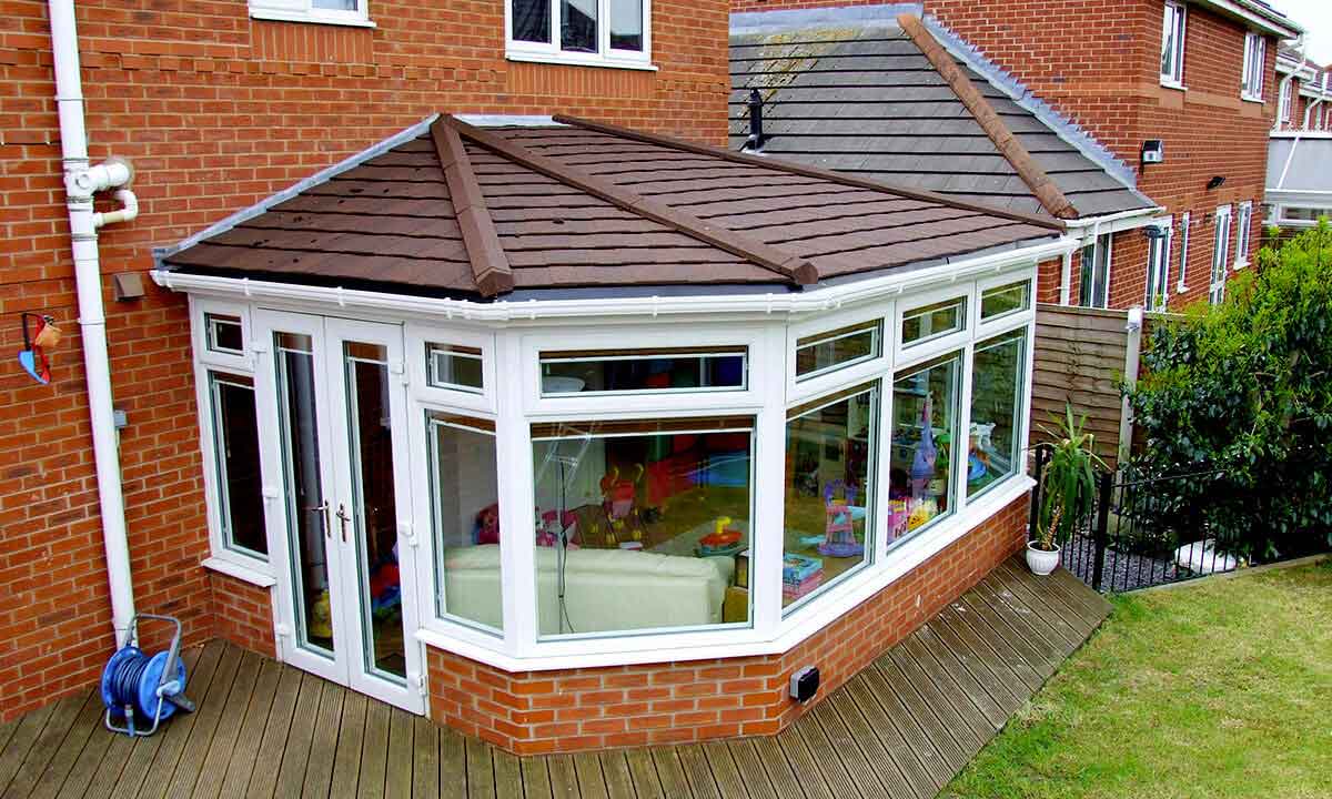 uPVC victorian conservatory with a brown tiled roof