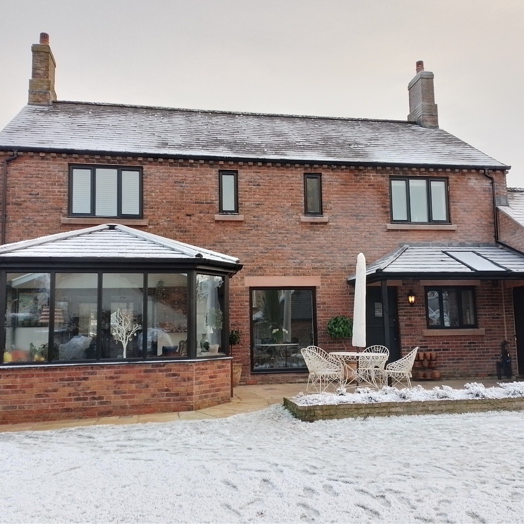 A snowy roof and garden.