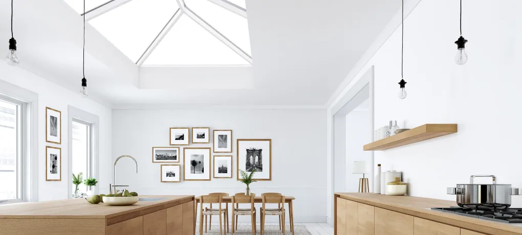 A white kitchen showing a roof laten