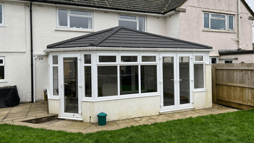 white upvc conservatory with a tiled roof