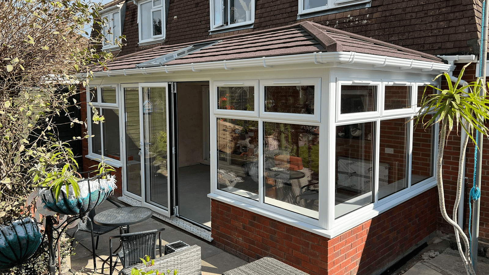 white upvc conservatory with a tiled roof