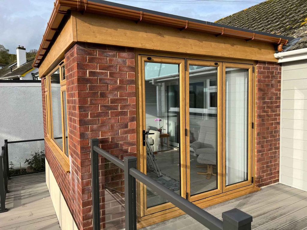 brown upvc extension bifold doors