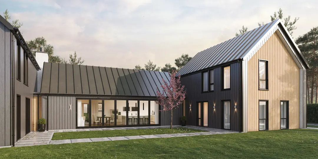 A modern barn-style home featuring Alumina aluminium bifold doors, seamlessly connecting the indoor space to the outdoor garden.